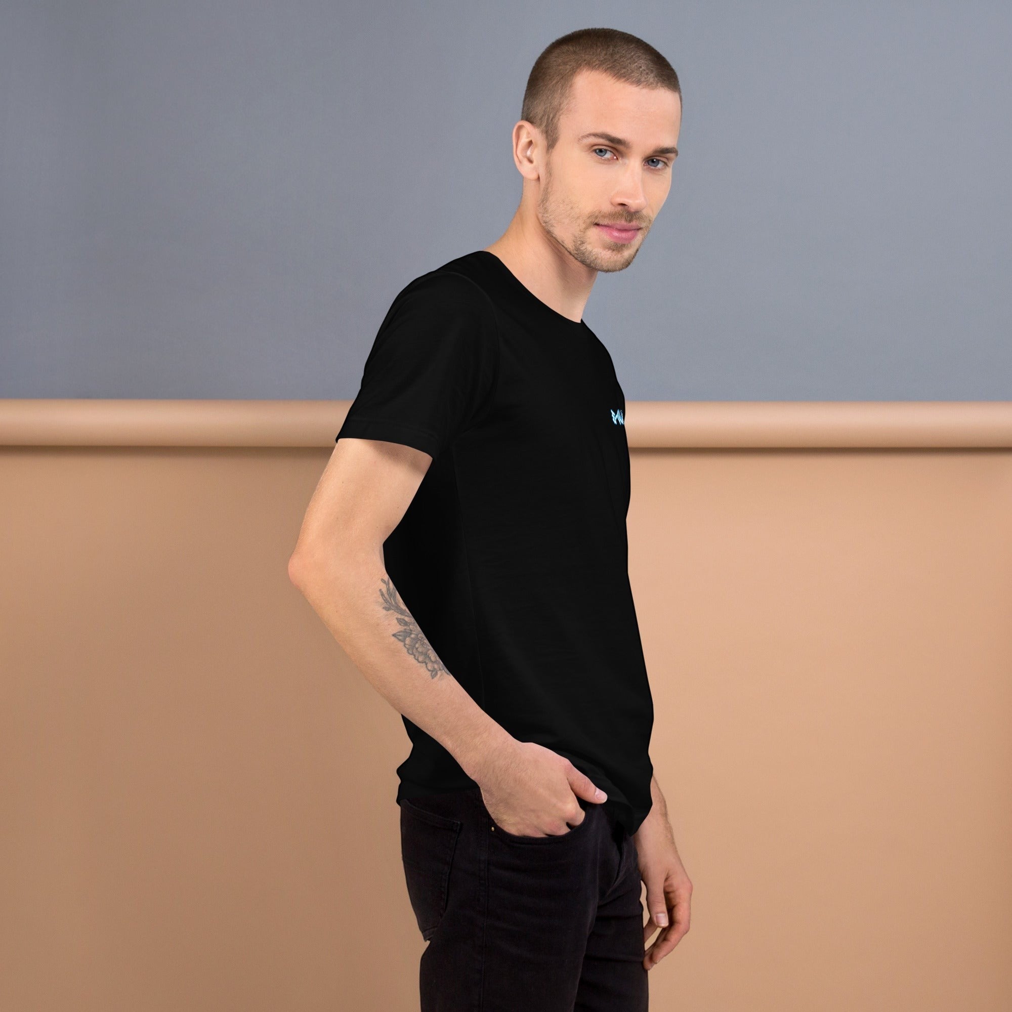 E-clipse black 100% cotton t-shirt with subtle blue logo on chest, worn by a man with a tattoo on his arm.